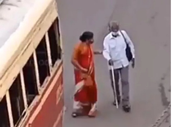 woman ensuring blind man boards bus video viral